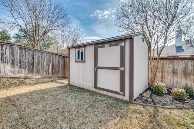 view of outbuilding with a yard