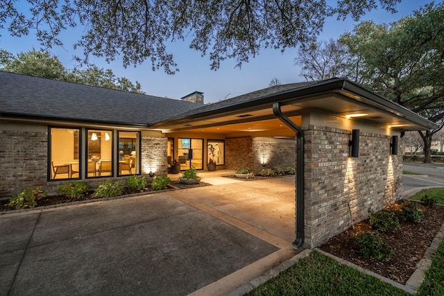 patio terrace at dusk with a carport