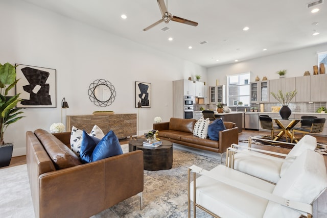 living room with sink and ceiling fan