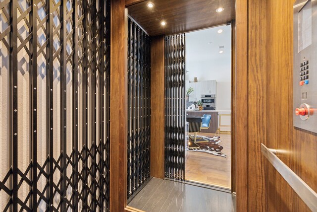 wine area with hardwood / wood-style floors