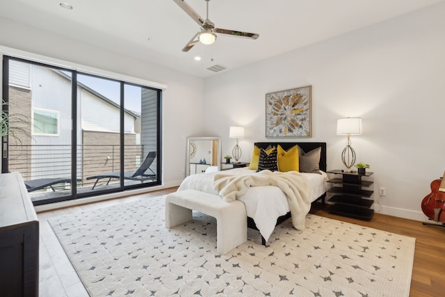 bedroom featuring access to exterior, ceiling fan, and light hardwood / wood-style flooring