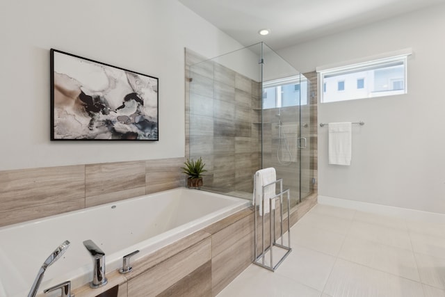 bathroom featuring tile patterned floors and separate shower and tub