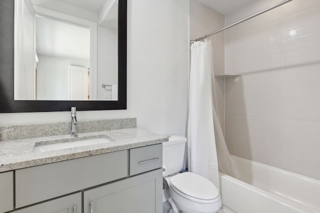 full bathroom featuring vanity, toilet, and shower / bath combo with shower curtain