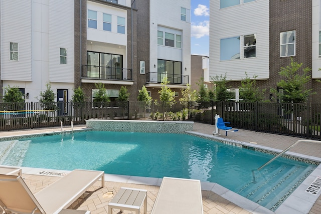 view of swimming pool featuring a patio area