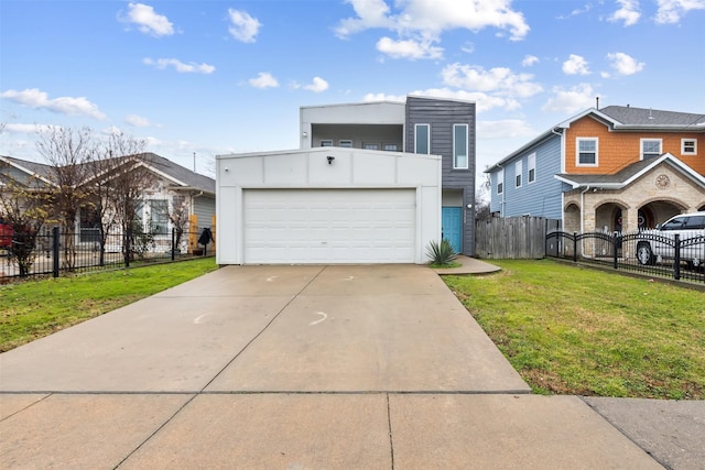 view of front facade with a garage and a front lawn