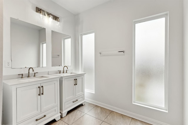 bathroom featuring vanity, tile patterned flooring, and a wealth of natural light