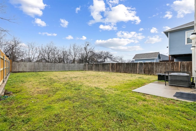 view of yard with a patio area and central air condition unit