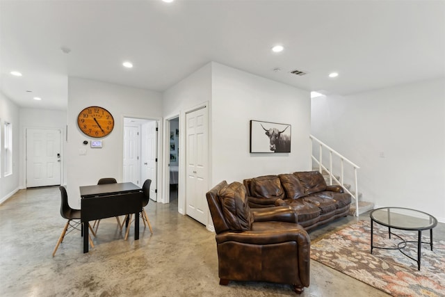 living room featuring concrete floors