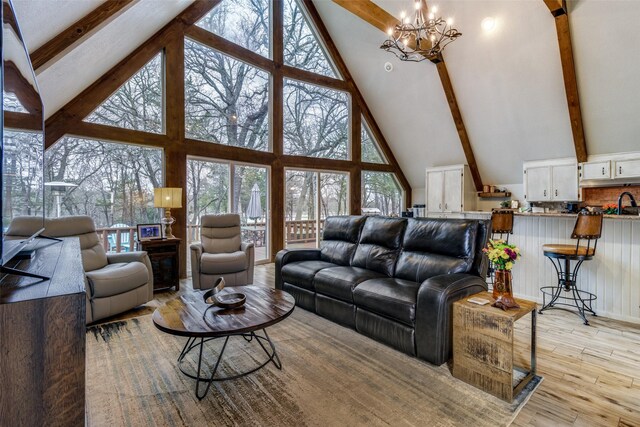 birds eye view of property featuring a view of the beach and a water view