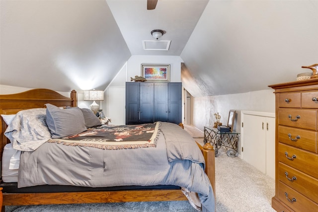 bedroom featuring carpet floors, lofted ceiling, and a ceiling fan