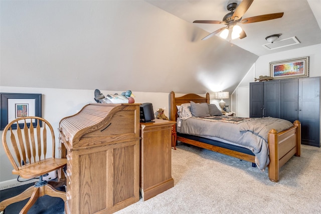 bedroom featuring light carpet, visible vents, vaulted ceiling, and ceiling fan
