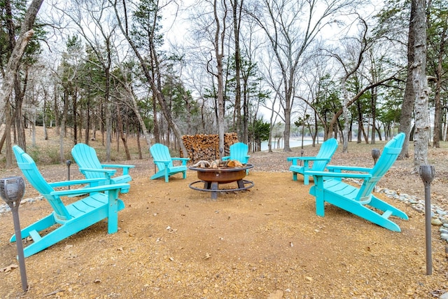 view of jungle gym with a fire pit