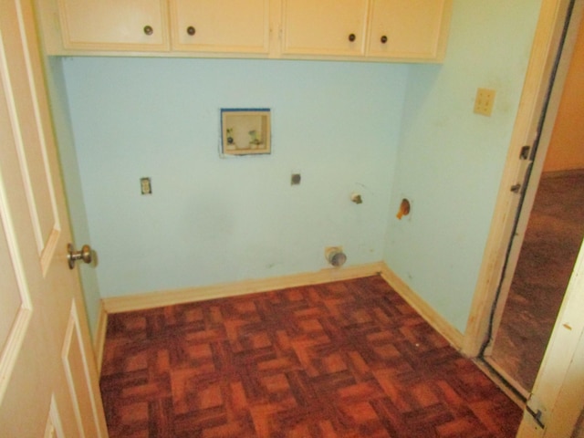 laundry area featuring cabinets, hookup for an electric dryer, hookup for a washing machine, and dark parquet floors