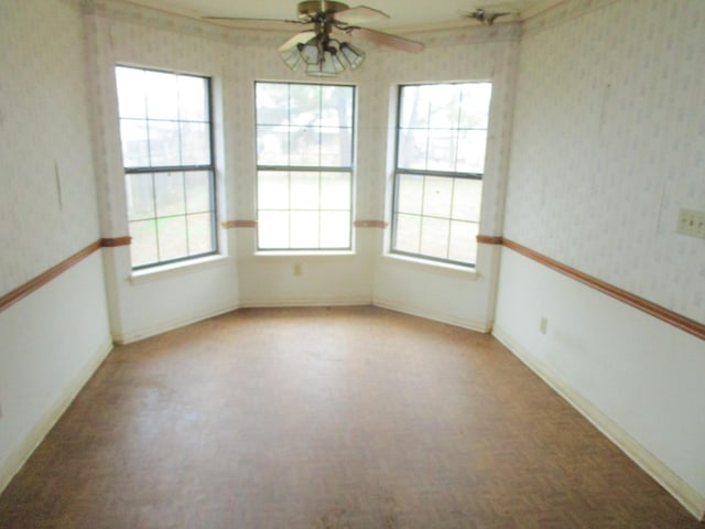 spare room with ceiling fan