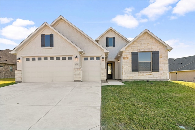 view of front of property featuring a garage and a front yard