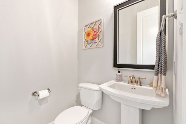 bathroom featuring sink and toilet