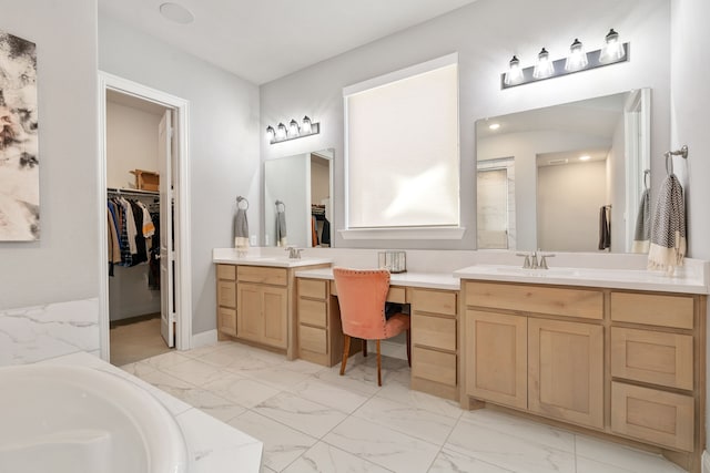 bathroom featuring vanity and a bathing tub