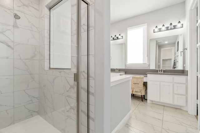 bathroom with vanity and a shower with shower door