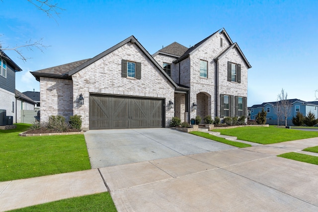 view of front facade with a garage and a front yard