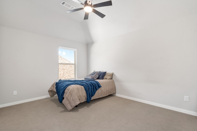 carpeted bedroom with ceiling fan and lofted ceiling