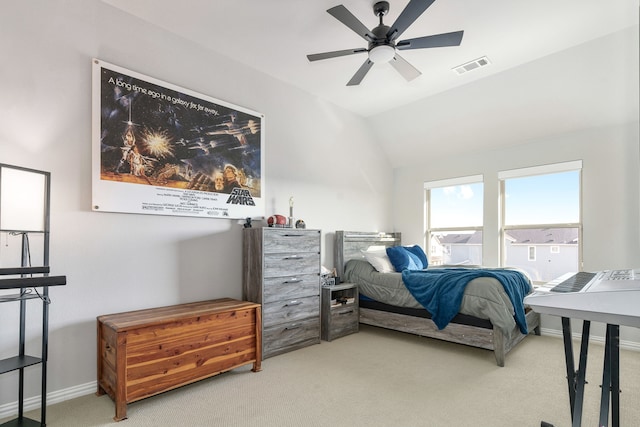 bedroom featuring ceiling fan, lofted ceiling, and light carpet