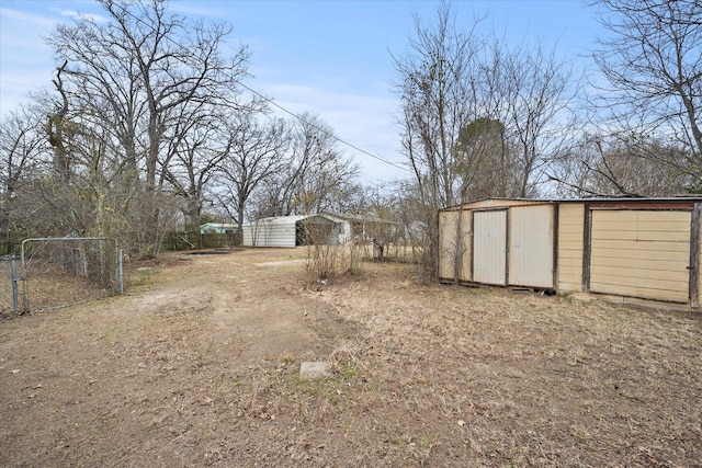 view of yard with a storage unit