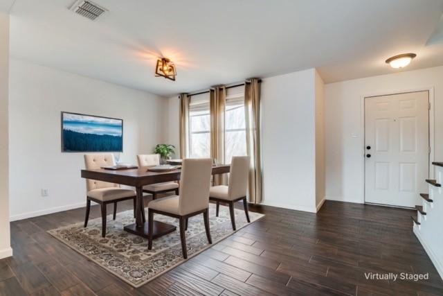 unfurnished living room featuring dark wood-type flooring, sink, and ceiling fan