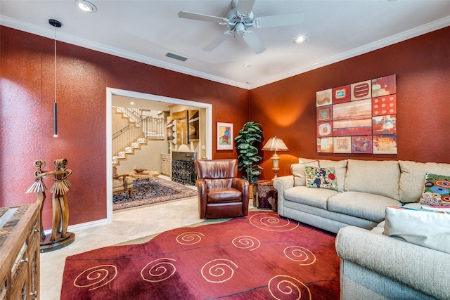 living room featuring crown molding and ceiling fan