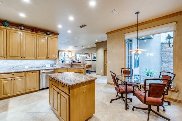 kitchen with decorative light fixtures, kitchen peninsula, dishwasher, and a center island