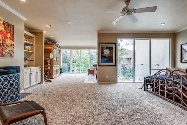 bedroom featuring a fireplace, carpet floors, access to outside, crown molding, and a textured ceiling