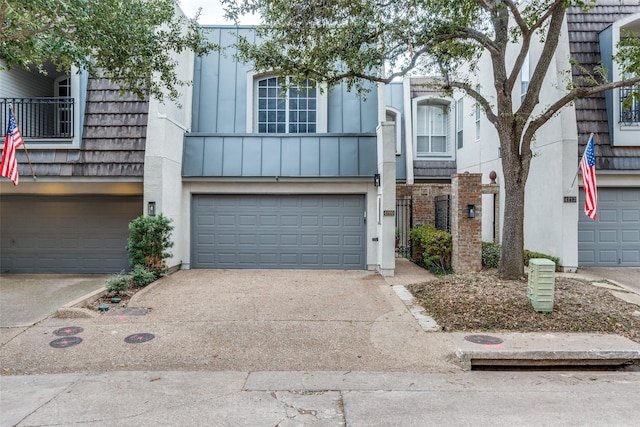 multi unit property featuring a garage