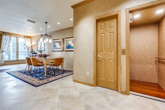 tiled dining space featuring crown molding and elevator