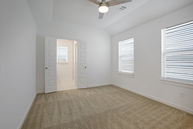 unfurnished room with light carpet, lofted ceiling, and ceiling fan