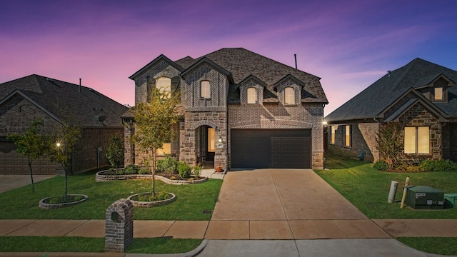 french country inspired facade featuring a garage and a lawn