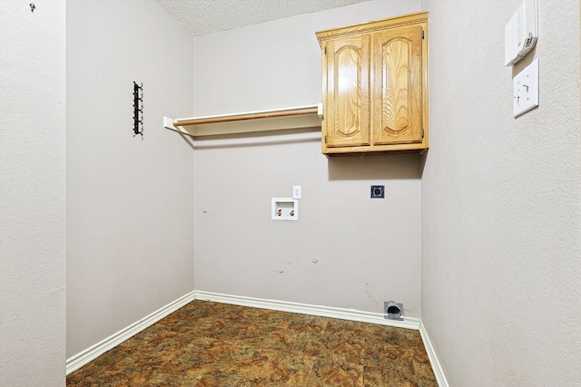 laundry area featuring washer hookup, electric dryer hookup, cabinets, and a textured ceiling