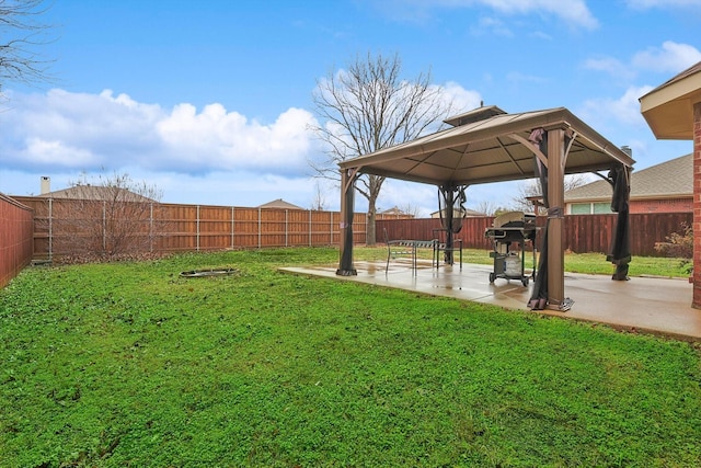 view of yard featuring a gazebo and a patio area