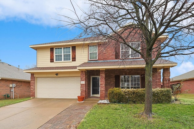 view of front of property with a garage and a front yard