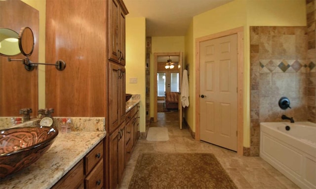 bathroom with vanity and a bathing tub