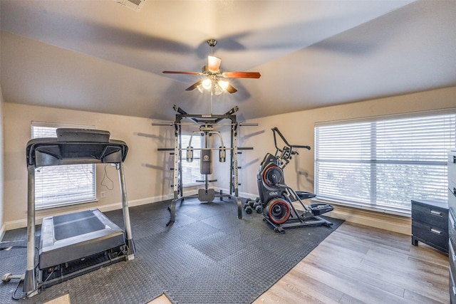 workout area with lofted ceiling, a healthy amount of sunlight, hardwood / wood-style floors, and ceiling fan