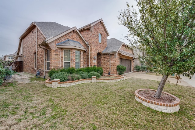 view of front of property with a garage and a front yard