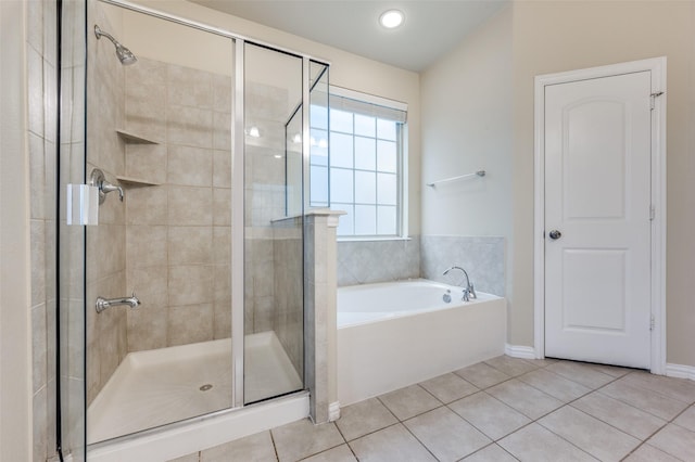 bathroom featuring shower with separate bathtub and tile patterned floors