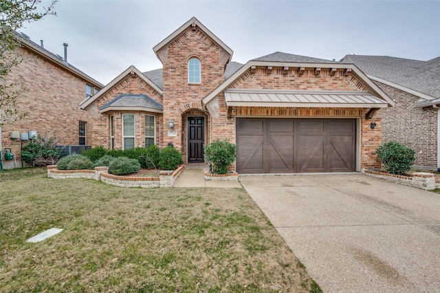 front facade with a garage and a front lawn