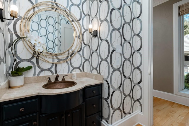 bathroom featuring vanity and hardwood / wood-style floors