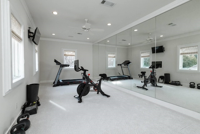 workout room with crown molding, light colored carpet, and ceiling fan