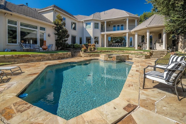 view of swimming pool with an in ground hot tub and a patio area