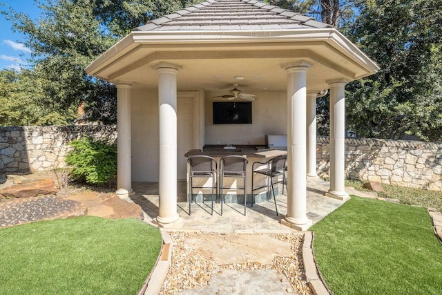 view of patio / terrace featuring a gazebo, an outdoor bar, and ceiling fan