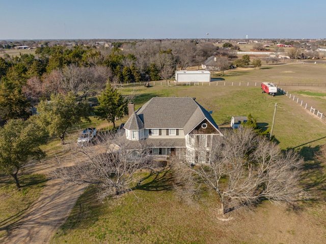 birds eye view of property featuring a rural view