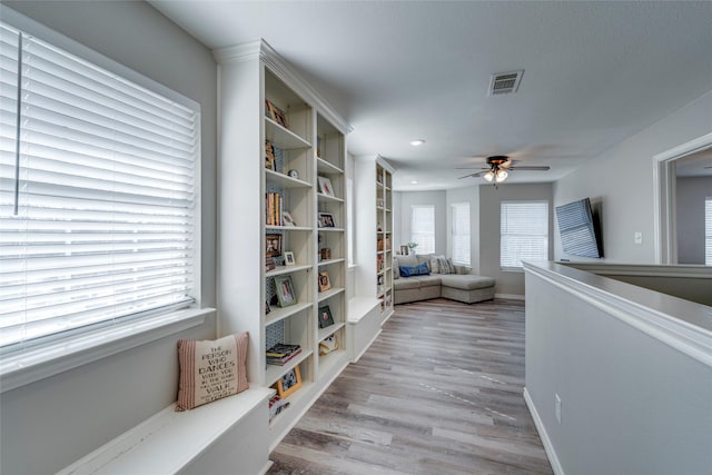 living area featuring ceiling fan, recessed lighting, wood finished floors, visible vents, and baseboards