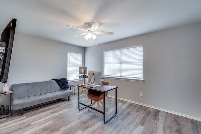 office area featuring ceiling fan, baseboards, and wood finished floors