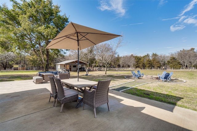 view of patio / terrace with an outbuilding and outdoor dining area